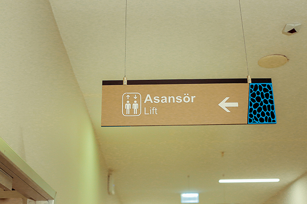 acrylic suspended directional sign	