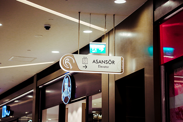 aluminum illuminated suspended directional elevator sign	