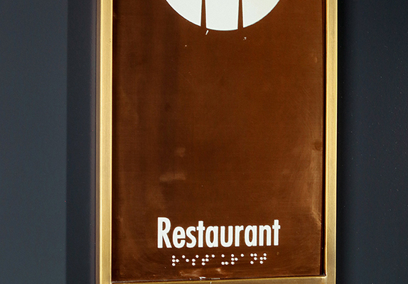 brass hotel door, pictogram signage