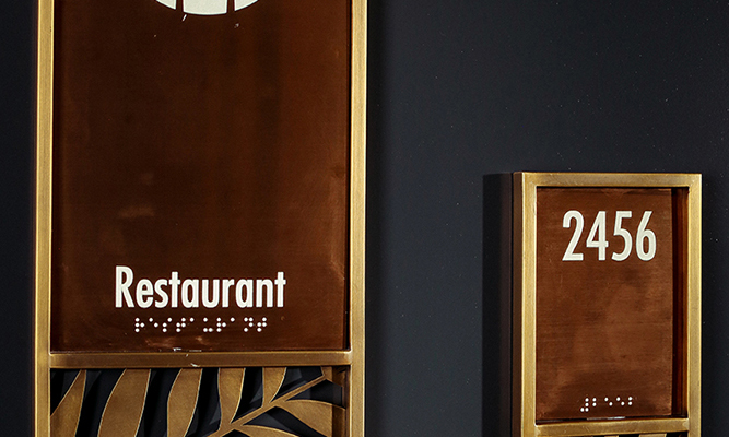 brass hotel door sign, pictogram signage