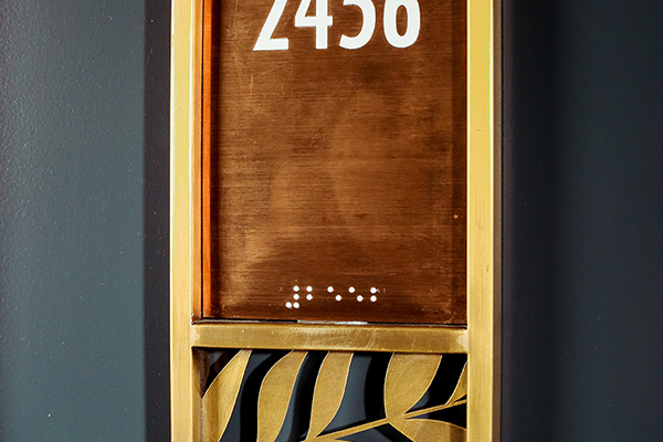 brass hotel door sign, pictogram signage